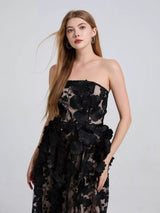 Black floral appliqué strapless midi dress, front view.