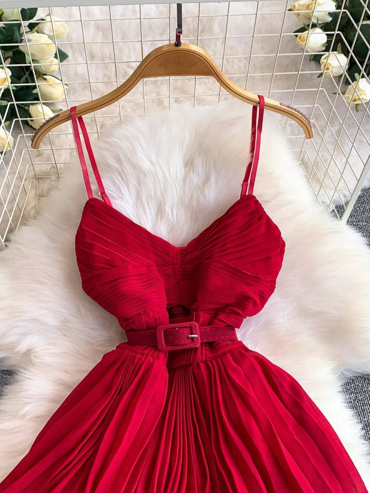 Red pleated layered spaghetti-strap midi dress, bodice detail.