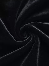Black sweetheart-neck pleated long-sleeve mini dress, fabric close-up.