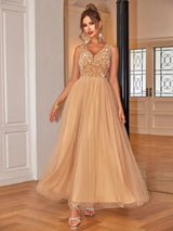 Champagne sleeveless embellished V-neck floor-length gown
