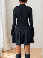 Black mock-neck long-sleeve mini dress, back view.