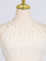 Ivory ruched halter neck maxi dress, neckline detail.