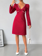 Red pearl-trim v-neck bodycon dress, front view.