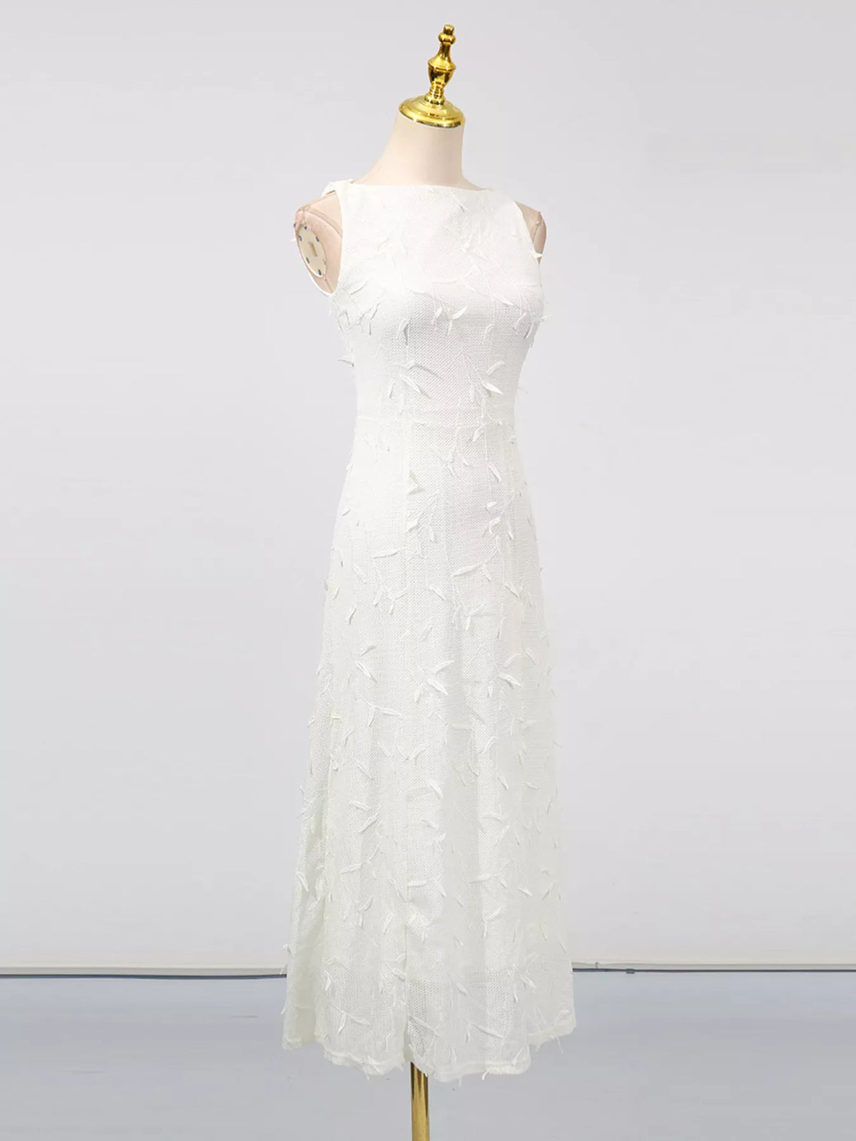 White sleeveless floral appliqué midi dress, front view.