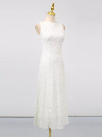 White sleeveless floral appliqué midi dress, front view.