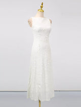 White sleeveless floral appliqué midi dress, front view.