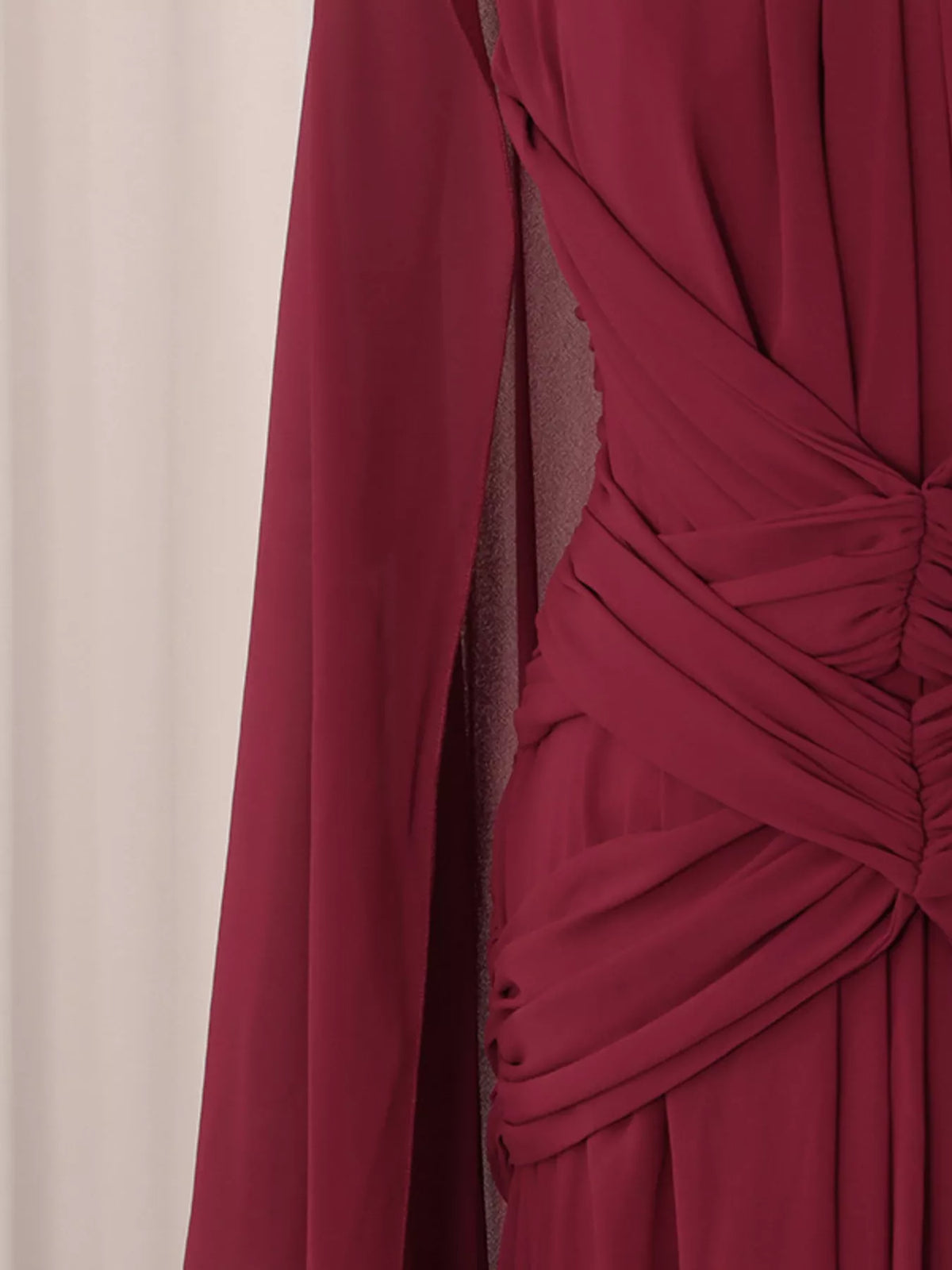 Burgundy ruched halter cape maxi dress, waist detail.