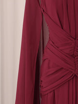 Burgundy ruched halter cape maxi dress, waist detail.