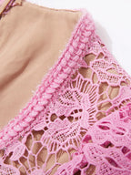 Pink lace button-up midi dress with pockets, neckline detail.
