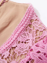 Pink lace button-up midi dress with pockets, neckline detail.