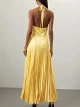 Yellow pleated halter-neck maxi dress, back view.