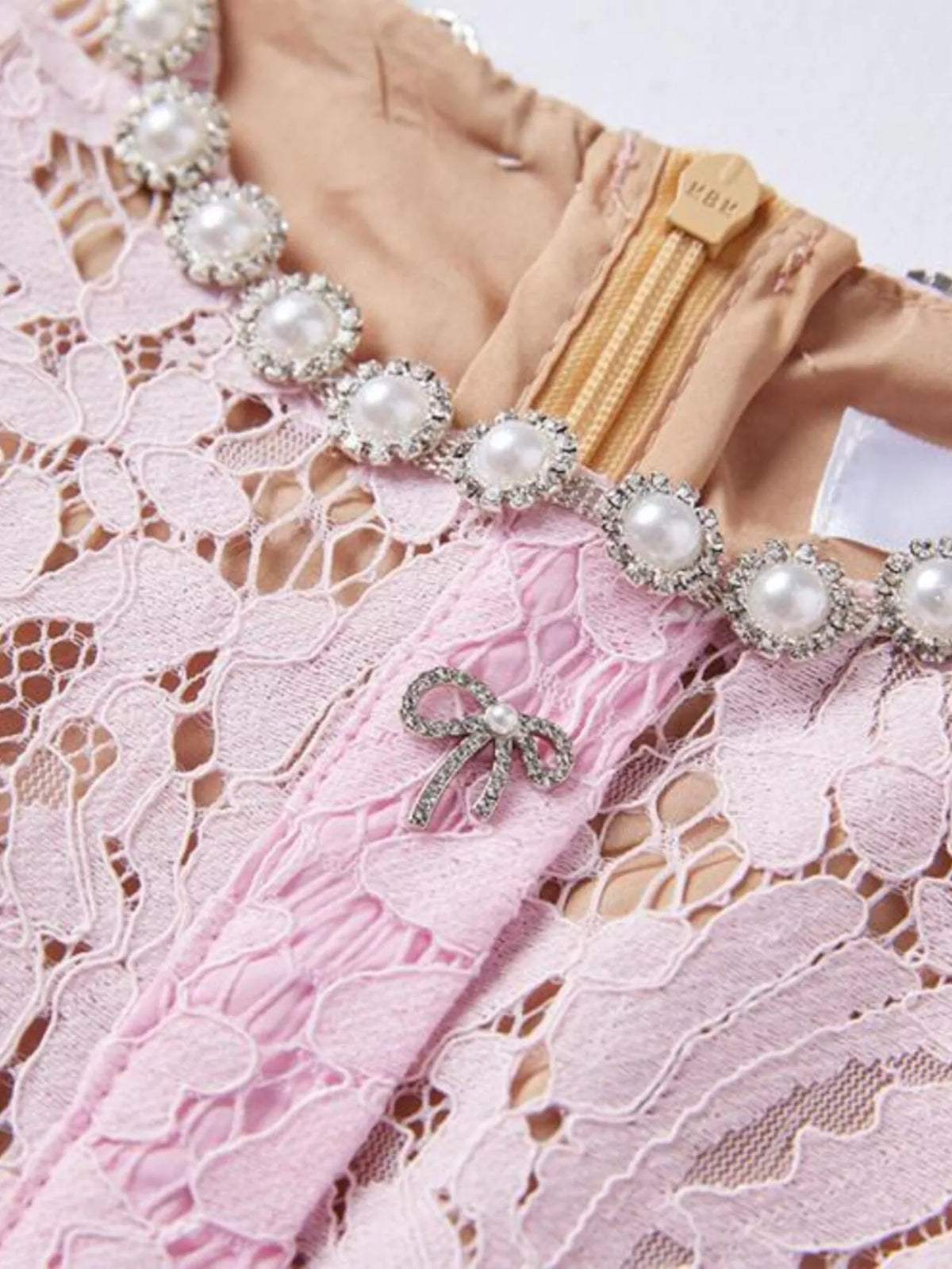 Pink short-sleeve lace mermaid midi dress, zipper detail.