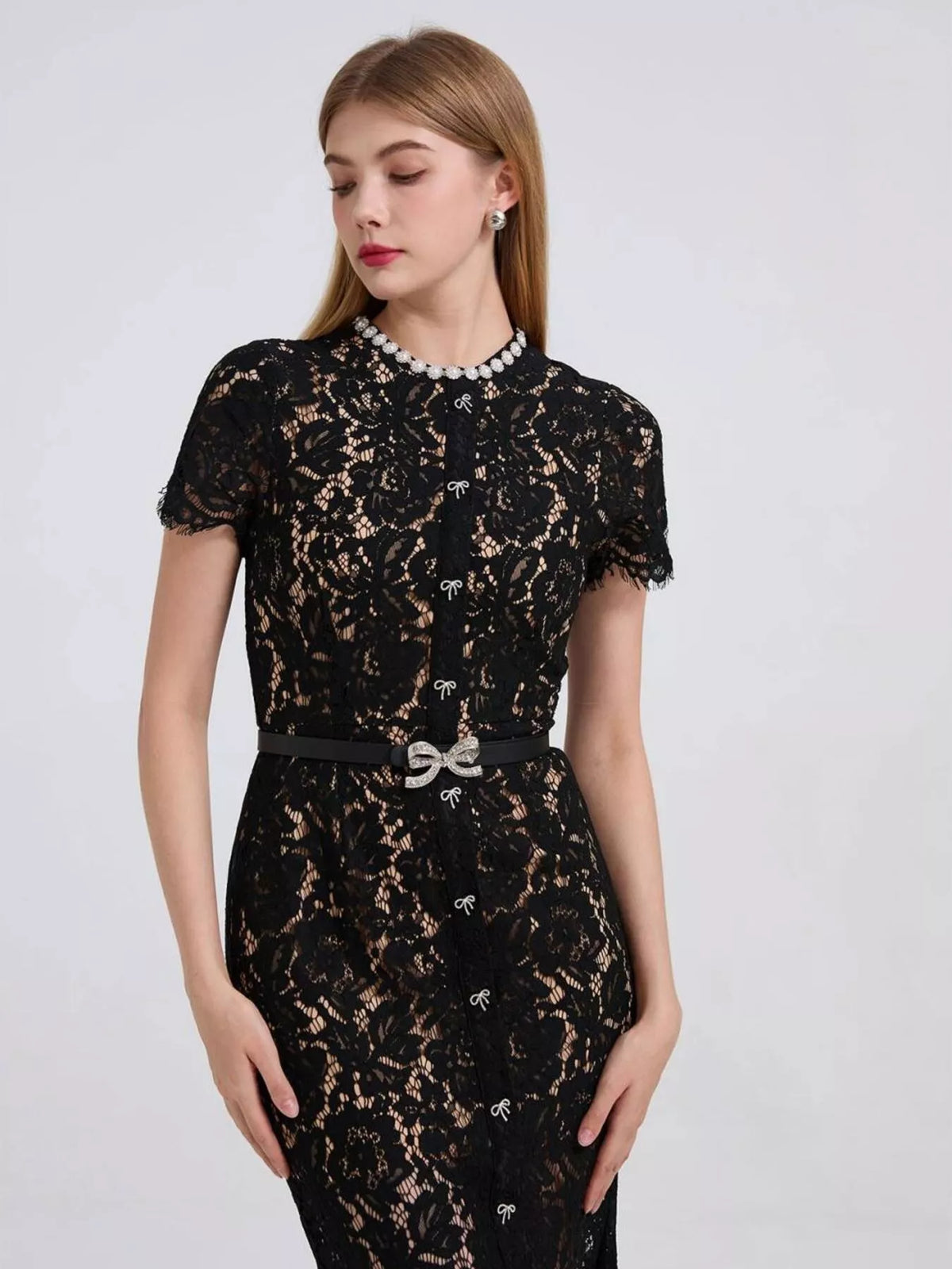 Black short-sleeve lace mermaid midi dress, neckline detail.