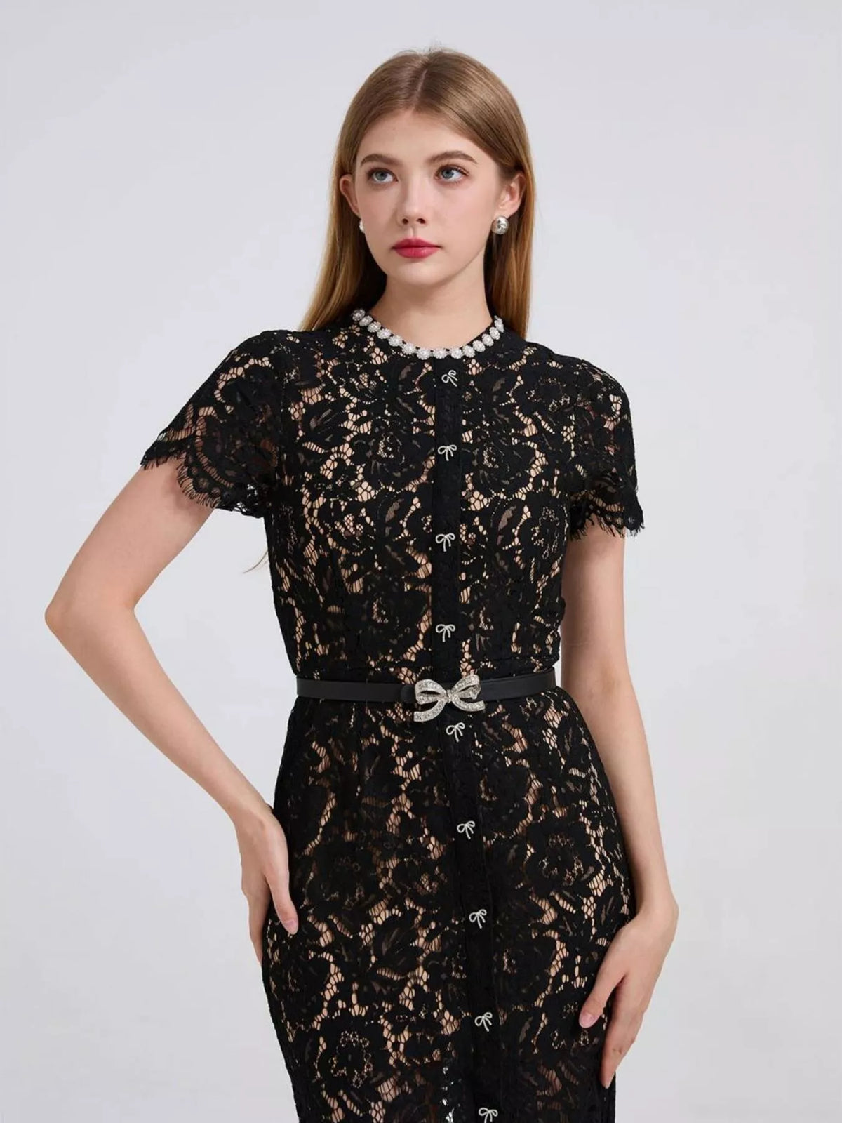 Black short-sleeve lace mermaid midi dress, front view.