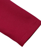 Red pearl-trim v-neck bodycon dress, sleeve detail.