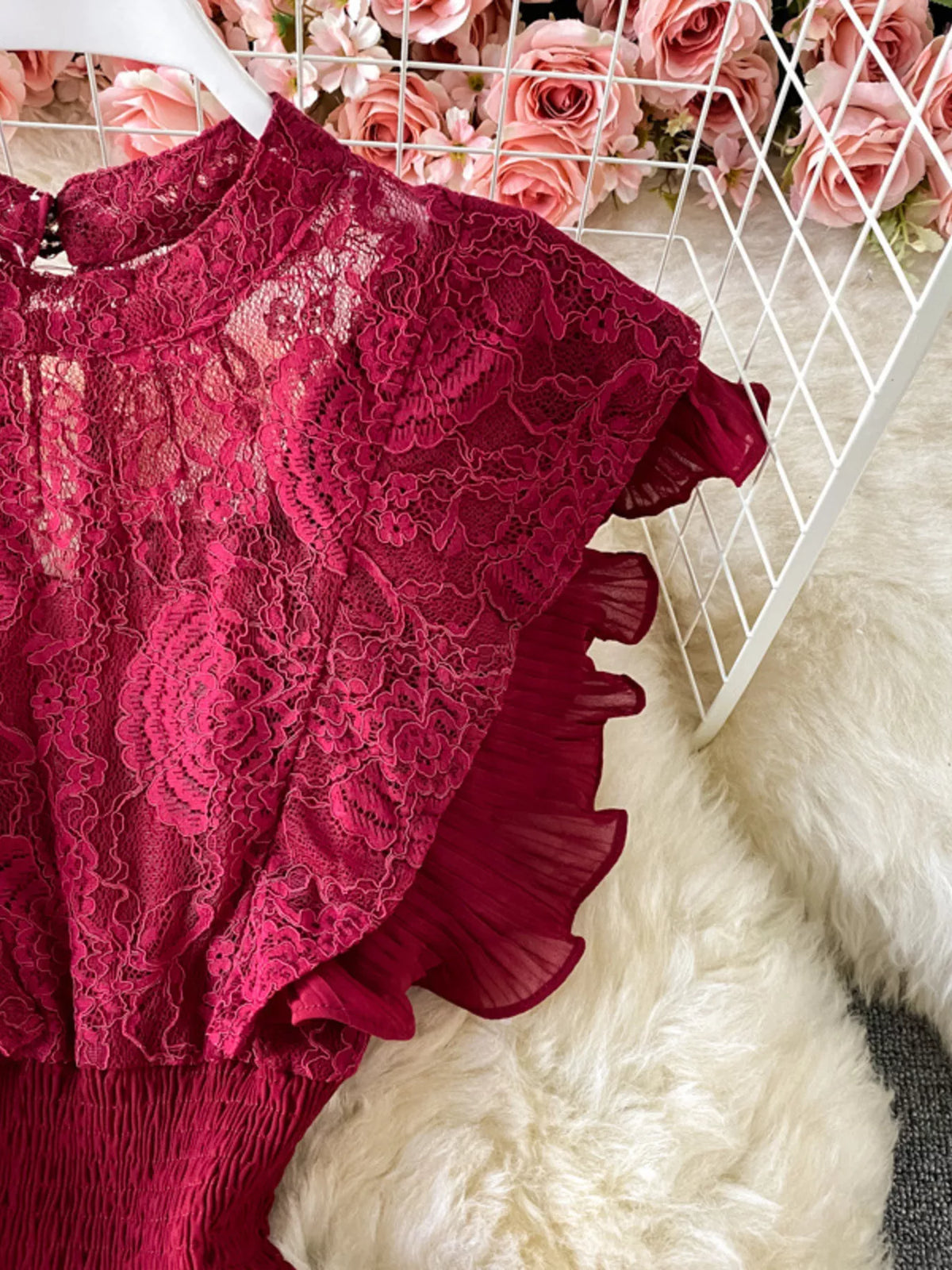 Burgundy ruffled mock-neck lace maxi dress, shoulder detail.