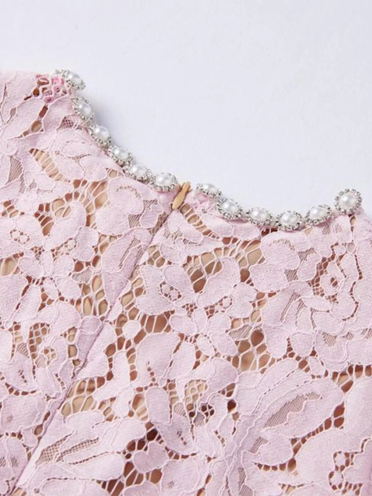 Pink short-sleeve lace mermaid midi dress, neckline detail.