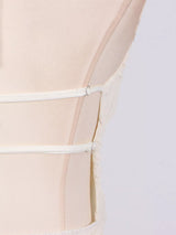 Ivory ruched halter neck maxi dress, back view.