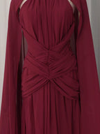 Burgundy ruched halter cape maxi dress, waist detail.