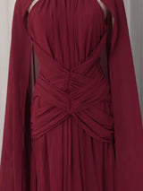 Burgundy ruched halter cape maxi dress, waist detail.