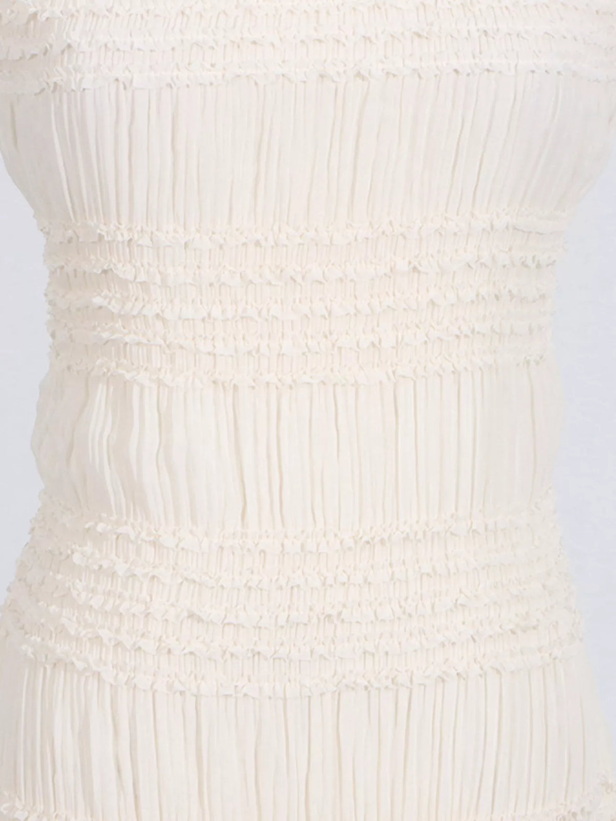 Ivory ruched halter neck maxi dress, skirt detail.