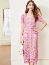 Pink lace button-up midi dress with pockets, front view.