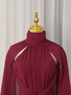 Burgundy ruched halter cape maxi dress, neckline detail.