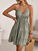 Sage-green smocked halter tiered mini dress, front view