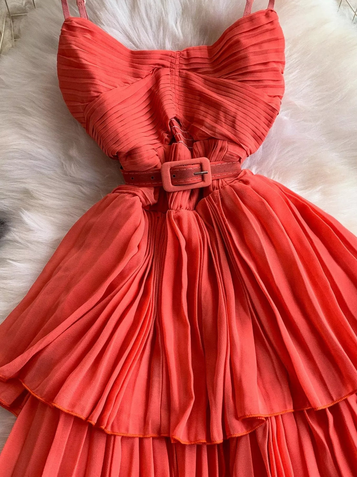 Coral pleated layered spaghetti-strap midi dress, waist detail.