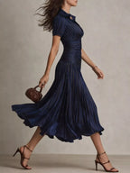 Navy striped midi dress, side view.