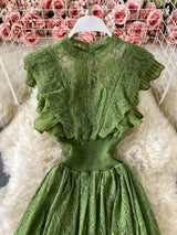 Green ruffled mock-neck lace maxi dress, front view.