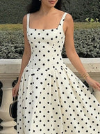 Cream polka-dot maxi dress side view