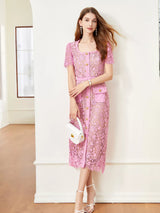 Pink lace button-up midi dress with pockets, front view.