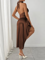 Brown ruched halter dress with high slit, back view