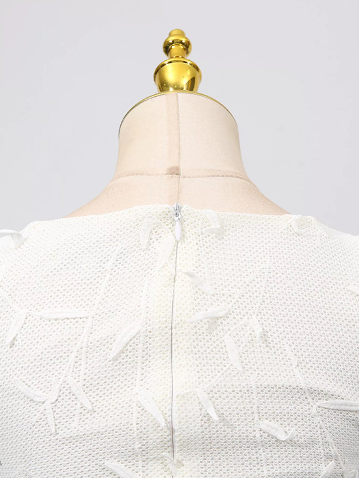 White sleeveless floral appliqué midi dress, back neckline detail.