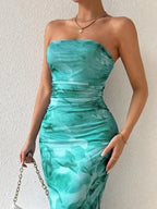 Turquoise printed strapless side-slit maxi dress, front view.