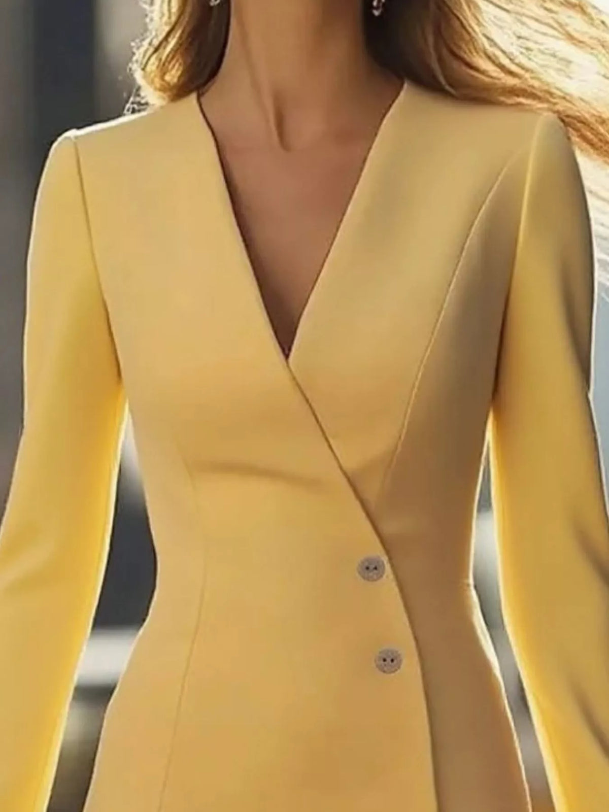 Yellow long-sleeve buttoned blazer mini dress, neckline detail.