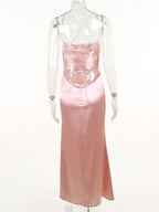 Blush-pink lace-up back dress on mannequin