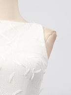 White sleeveless floral appliqué midi dress, neckline detail.