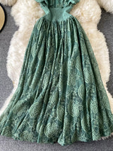 Dark green ruffled mock-neck lace maxi dress, skirt detail.