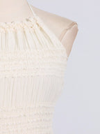 Ivory ruched halter neck maxi dress, bodice detail.