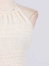 Ivory ruched halter neck maxi dress, bodice detail.