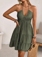 Olive green smocked halter tiered mini dress, front view