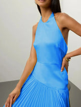 Blue pleated halter-neck maxi dress, neckline detail.
