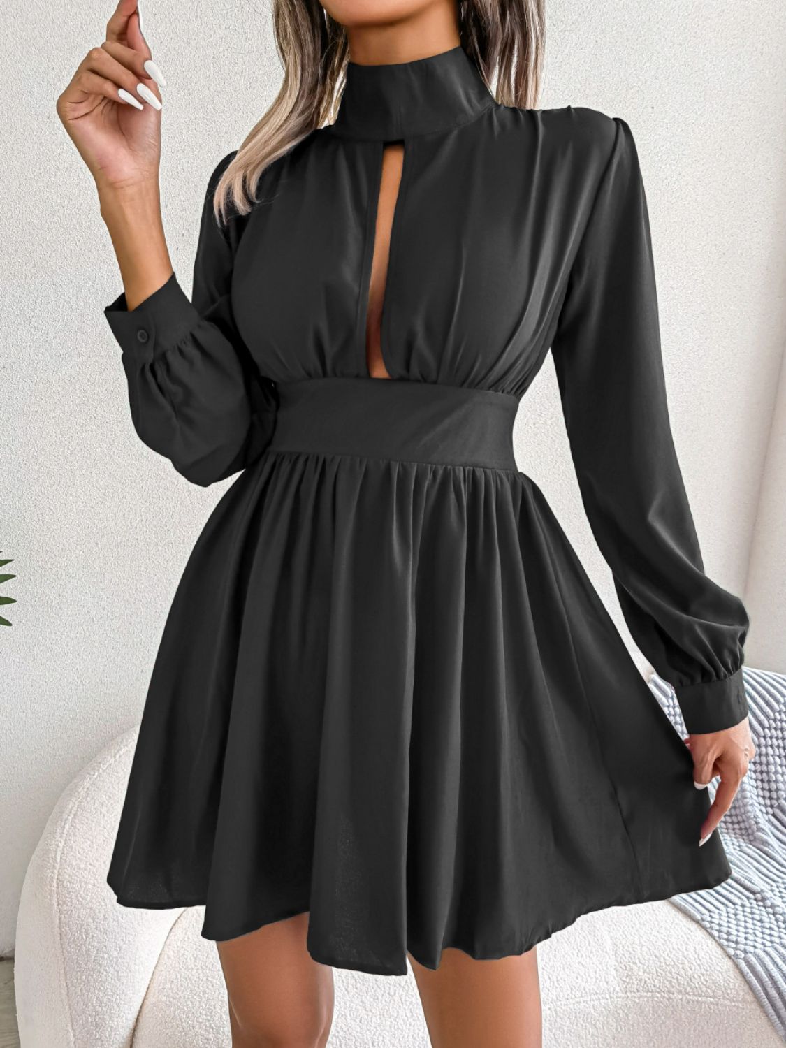 Black long-sleeve cutout-neck mini dress, front view