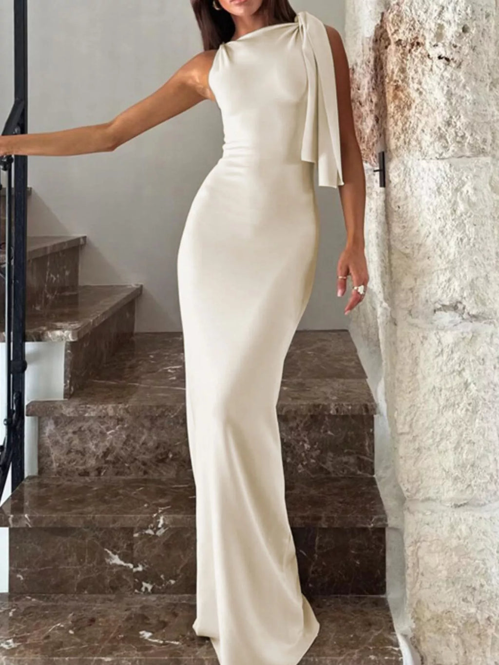 Draped asymmetrical sleeveless maxi dress in apricot front view