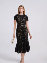 Black short-sleeve lace mermaid midi dress, front view.