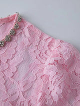 Pink lace long-sleeve midi dress, shoulder detail.