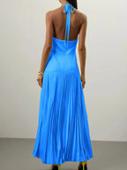 Blue pleated halter-neck maxi dress, back view.