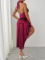 Burgundy ruched halter dress with high slit, back view